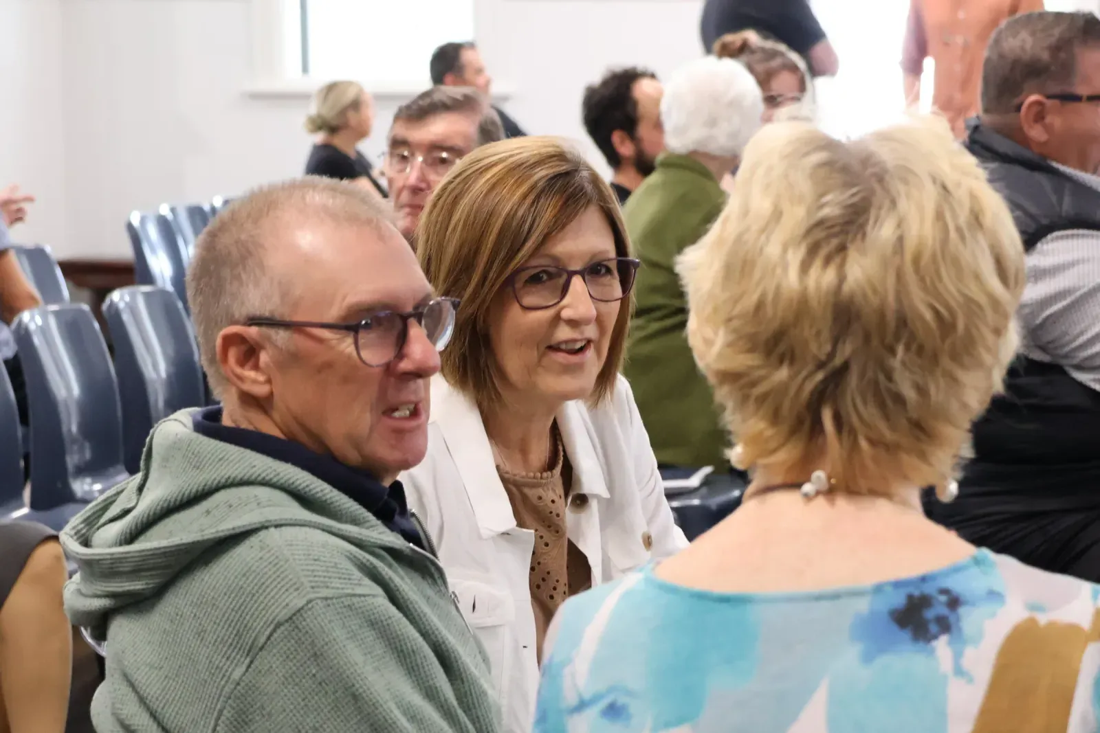 Church members chatting together before the Sunday service